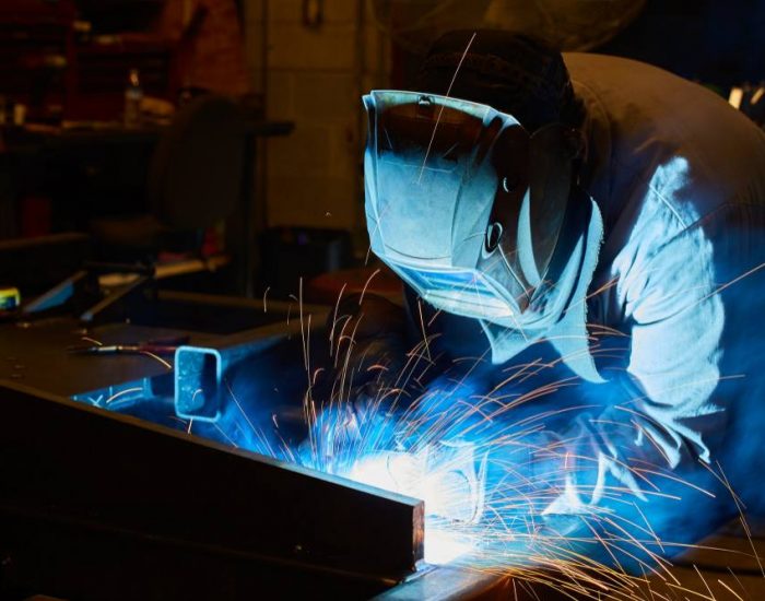 image-metal-worker-welding-with-welding-helmet-sparks-orange (1)